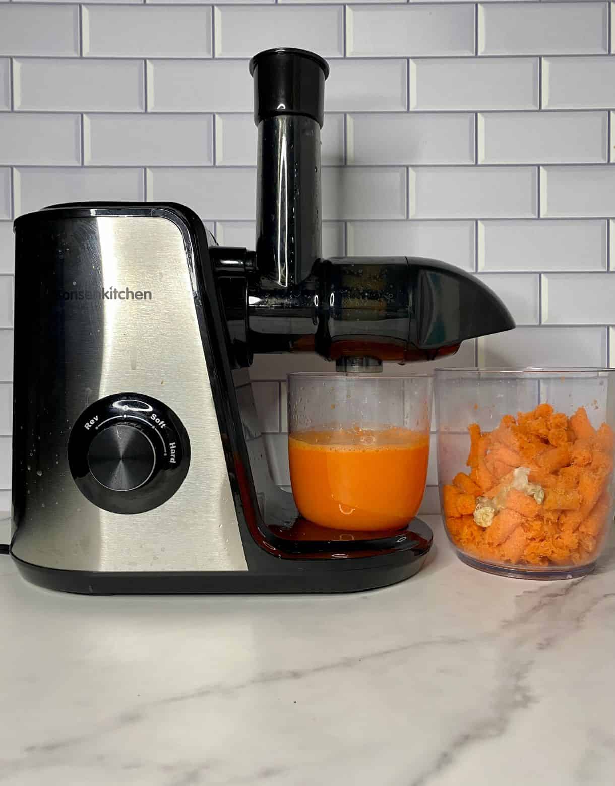 Juicer with Carrot Orange Ginger Juice and Pulp
