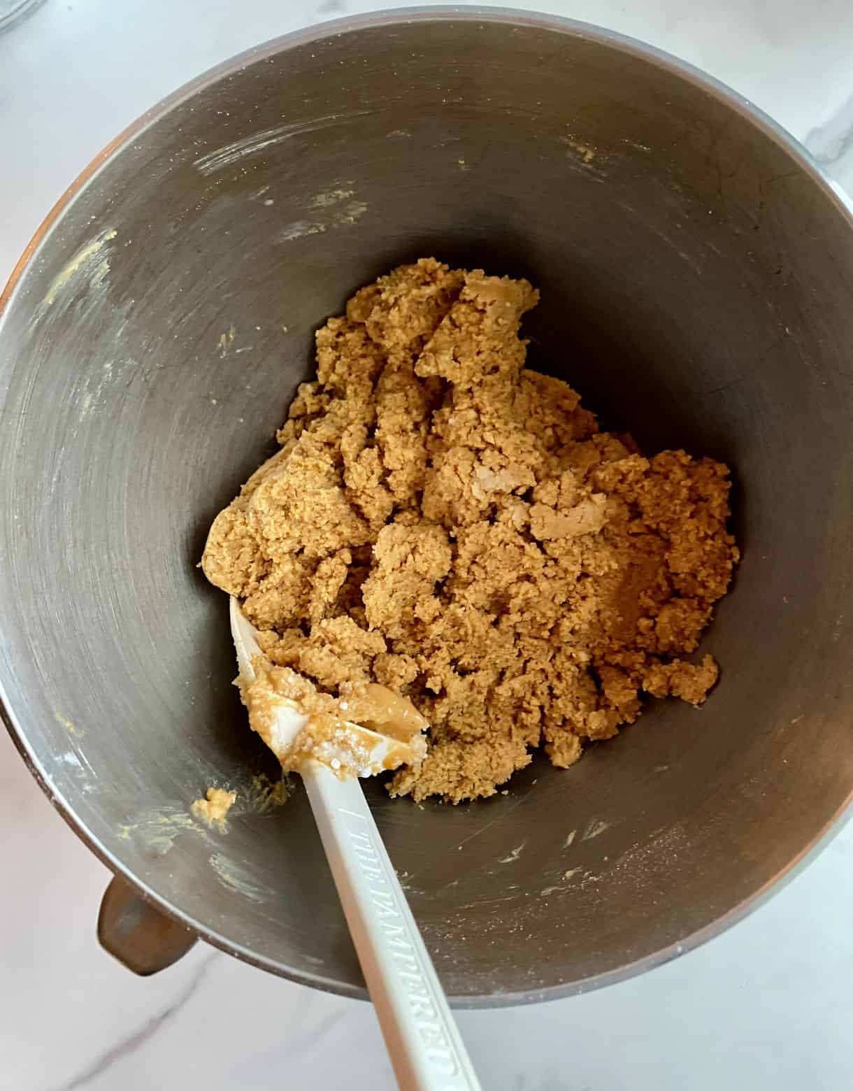 A mixing bowl with peanut butter doug for No-Bake Chocolate Peanut Butter Bars.