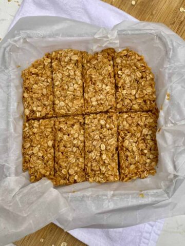 A pan of No-Bake Peanut Butter Granola Bars on a cutting board.