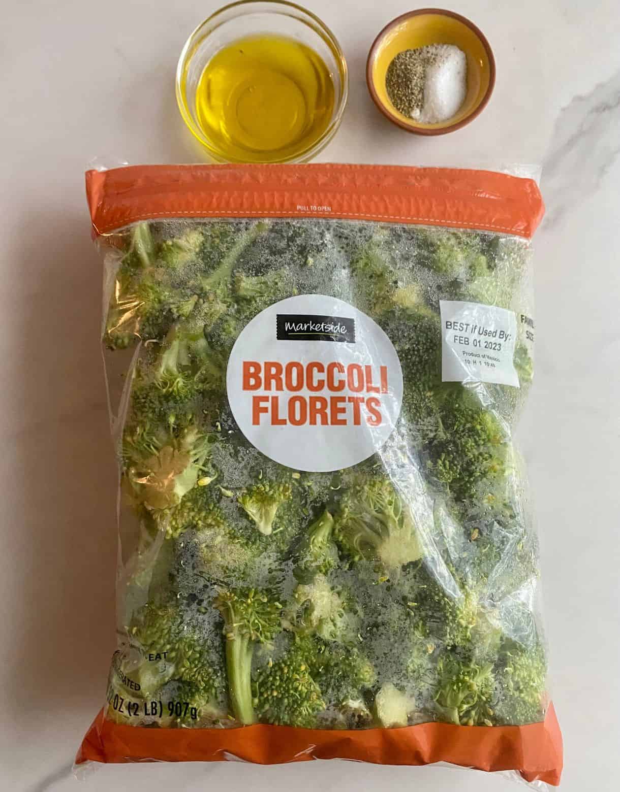 Ingredients for Roasted Sheet Pan Broccoli. Olive oil, salt, pepper and broccoli.