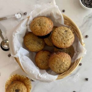 A basket of Healthy Banana Chocolate Chip Muffins.