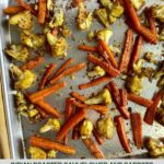 A sheet pan with roasted cauliflower and carrots.