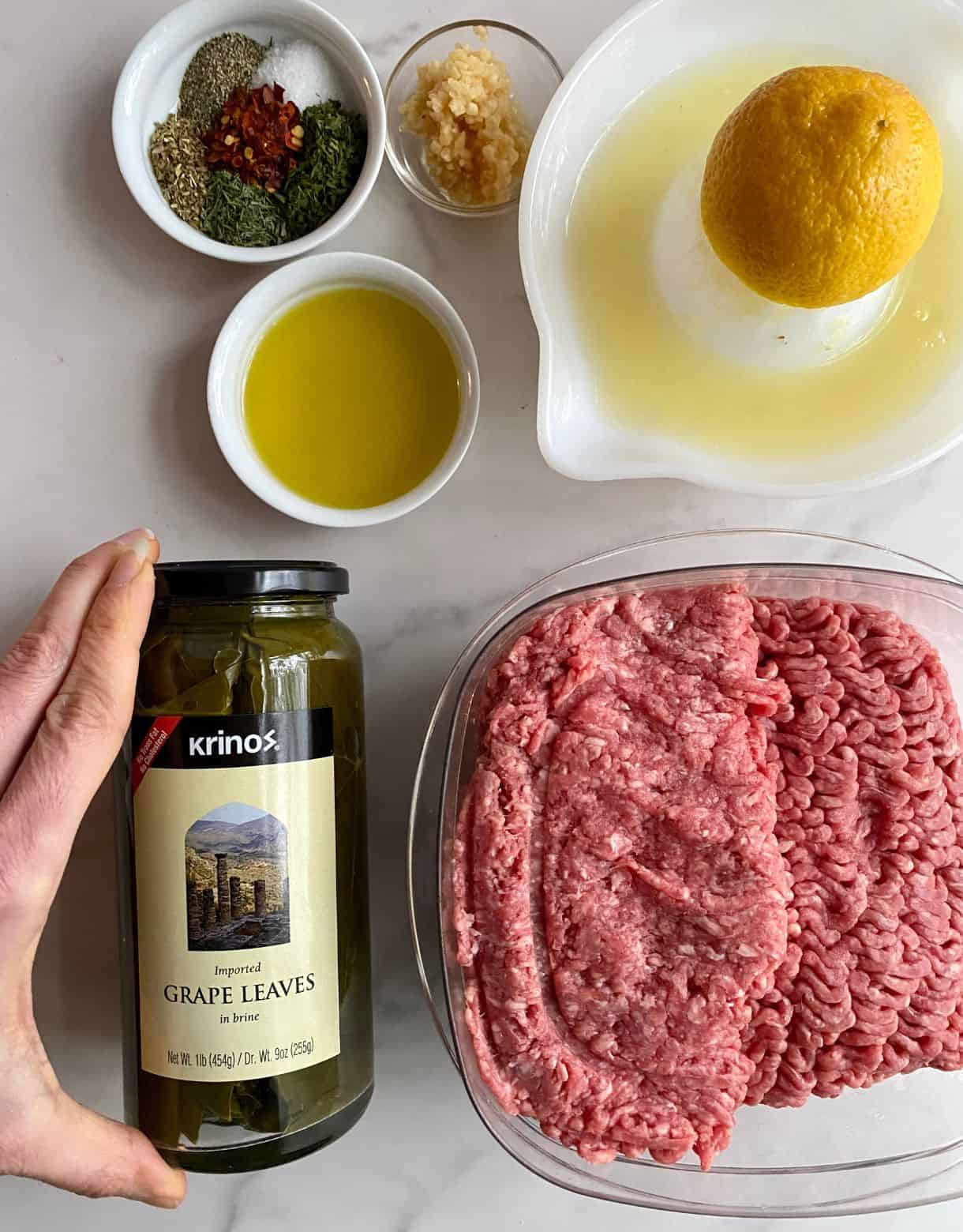 Ingredients for Lebanese Grape Leaves Bowl. Ground beef, lemon juice, olive oil, minced garlic, jarred grape leaves, dried parsley, dried dill, dried oregano, salt, pepper and red pepper flakes.