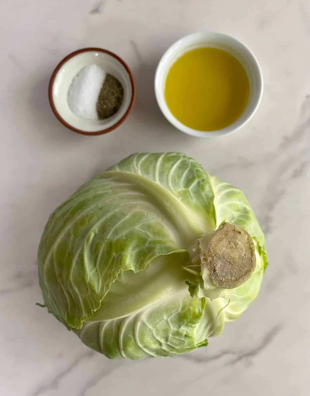 Ingredients for Oven Roasted Cabbage Steaks. Green cabbage, olive oil, salt and pepper.