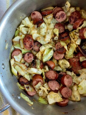 A skillet of cooked Southern Fried Cabbage with Sausage.