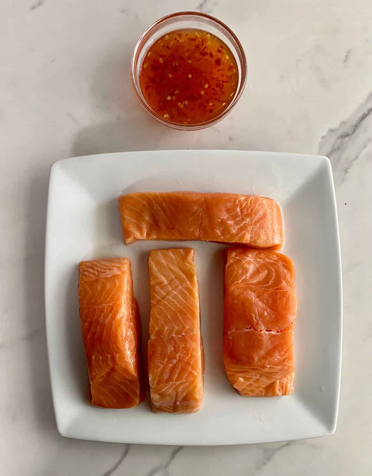 Ingredients for Sweet Chili Salmon. Salmon and sweet chili sauce.
