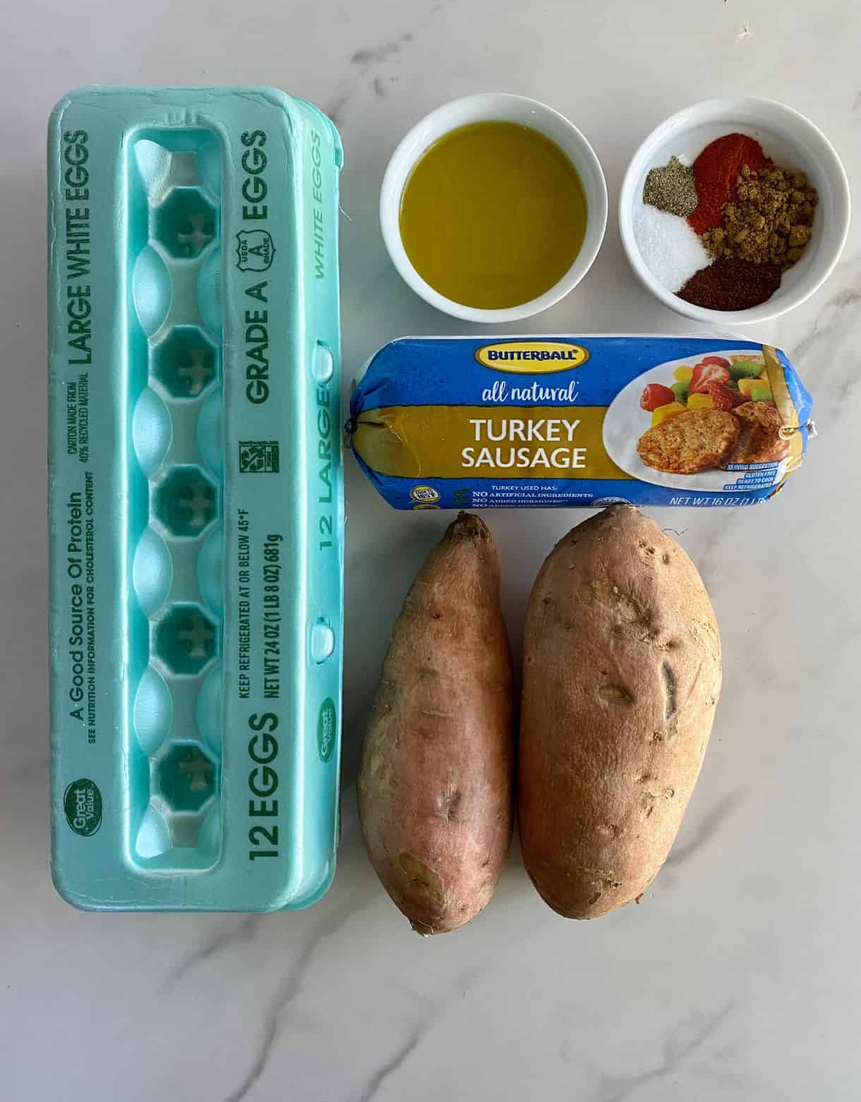 Ingredients for Sweet Potato Breakfast Hash. Eggs, olive oil, spices, turkey sausage and sweet potatoes.