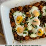 A pan of cooked Sweet Potato Breakfast Hash with sausage, sweet potatoes and eggs.