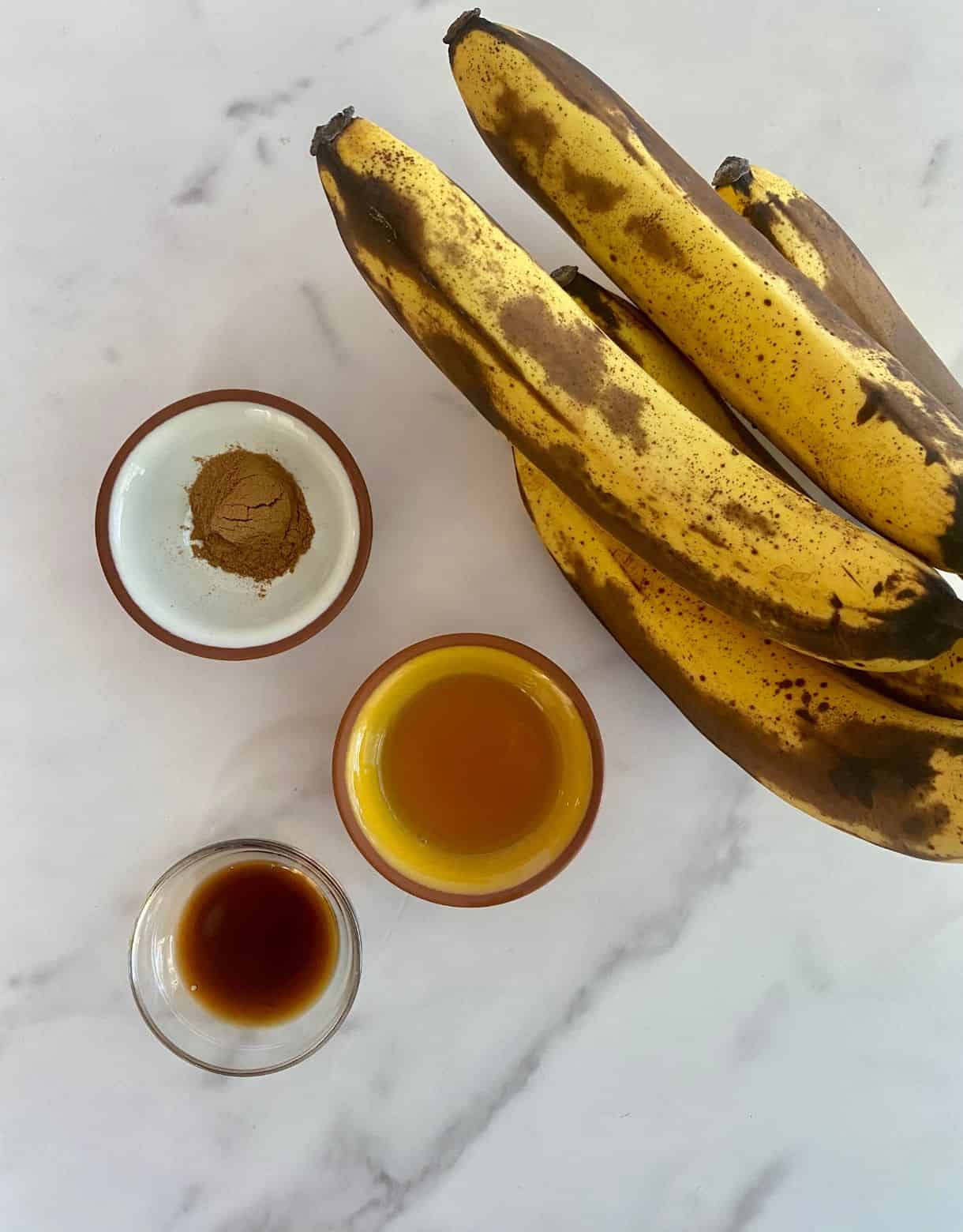 Ingredients for Healthy Bananas Foster. Bananas, bourbon, vanilla extract and cinnamon.