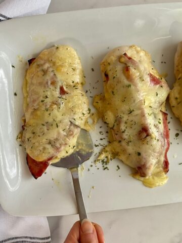 A platter with cooked Healthy Chicken Cordon Bleu.