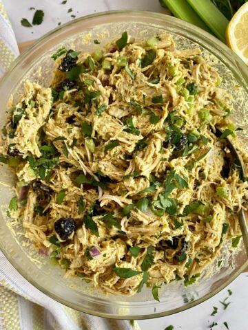 A bowl of Healthy Curried Chicken Salad all mixed together.