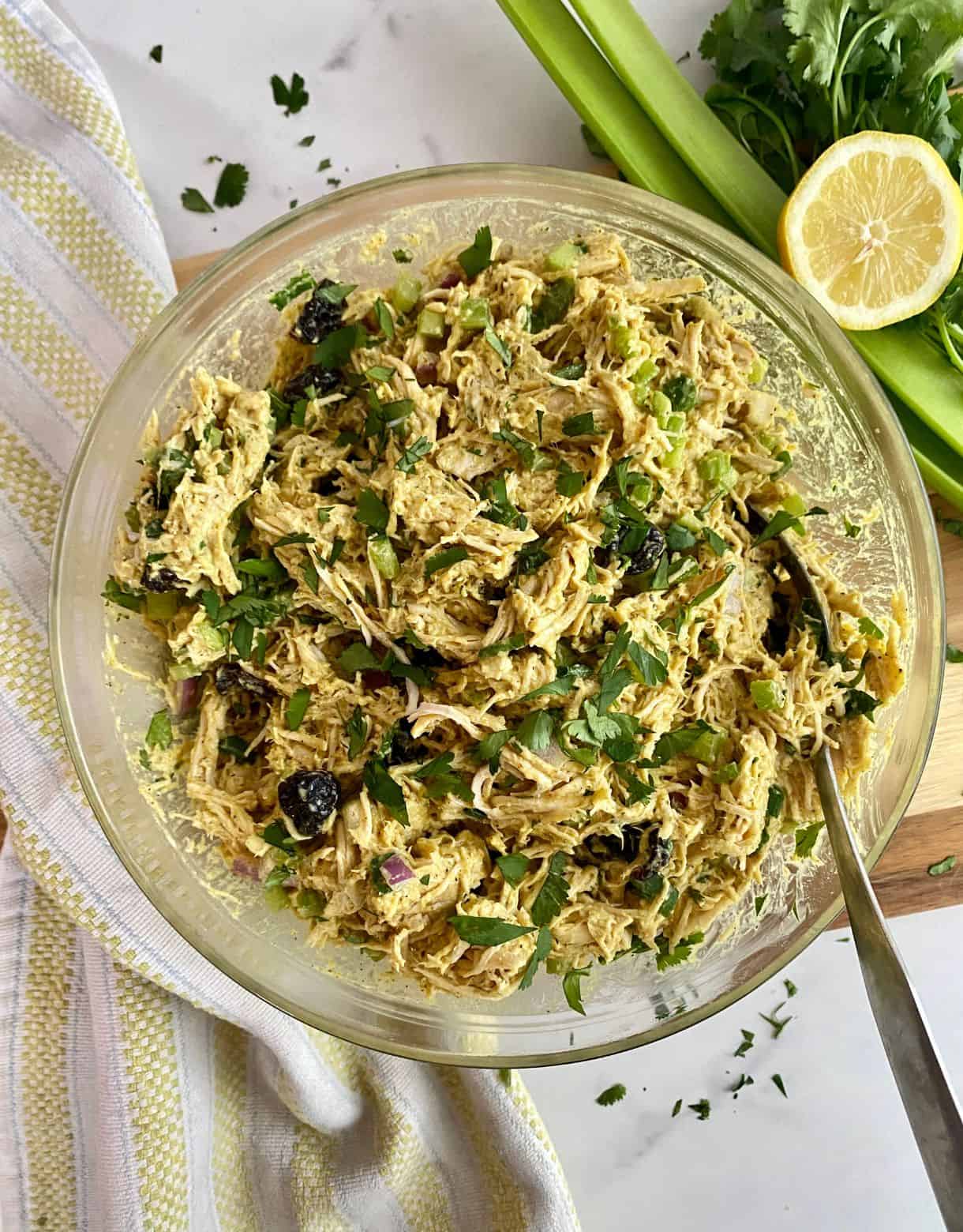 A bowl of Healthy Curried Chicken Salad all mixed together.