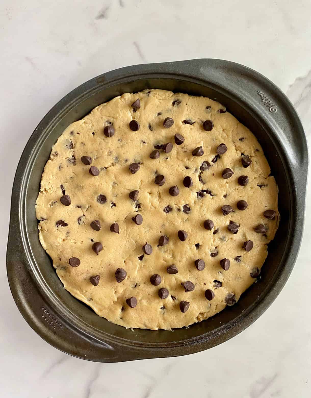 An unbaked Deep Dish Cookie Pie.