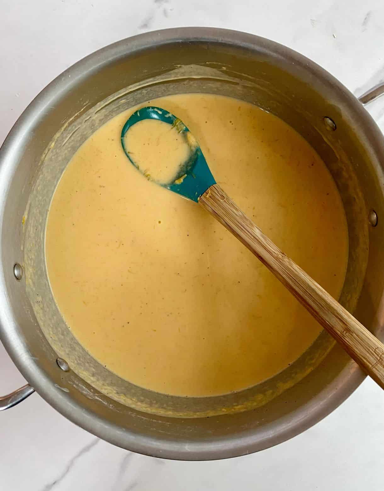 A pot with cheese sauce.