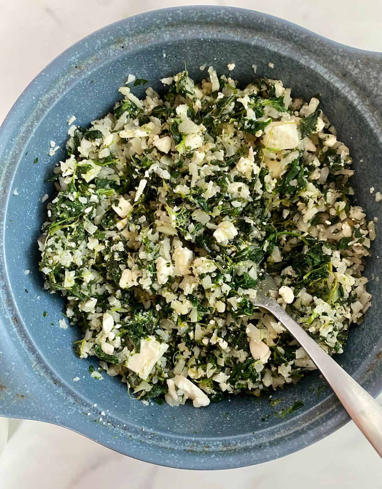 A dish with cooked Mediterranean Cauliflower Rice.