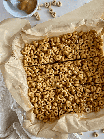 A pan of sliced Peanut Butter Cheerios Bars.