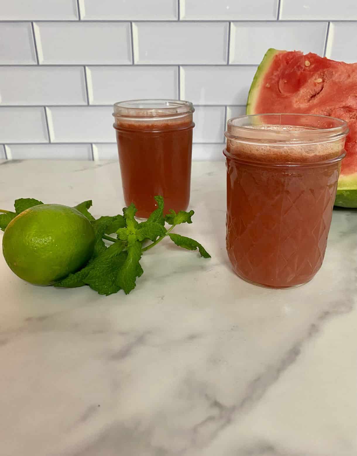 Two glasses of watermelon and cucumber juice.