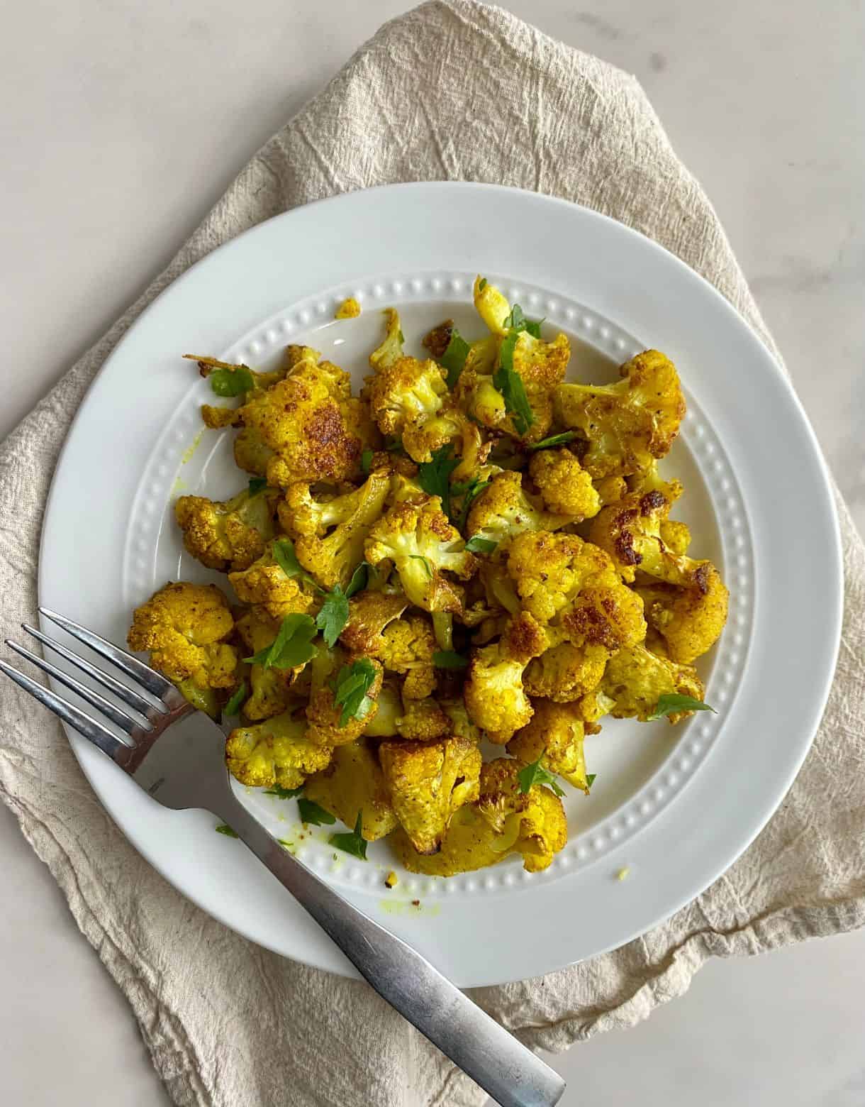 A plate of cooked Indian Roasted Cauliflower.