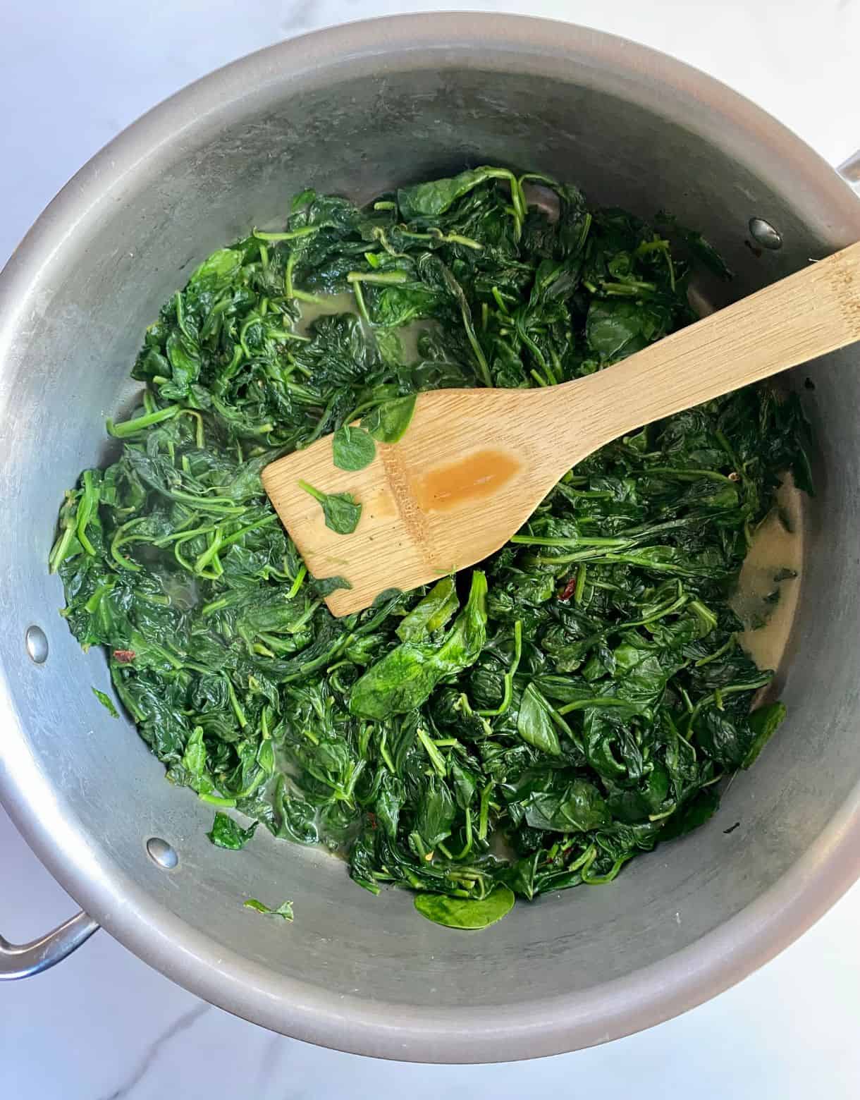 A pan of sauteed spinach.