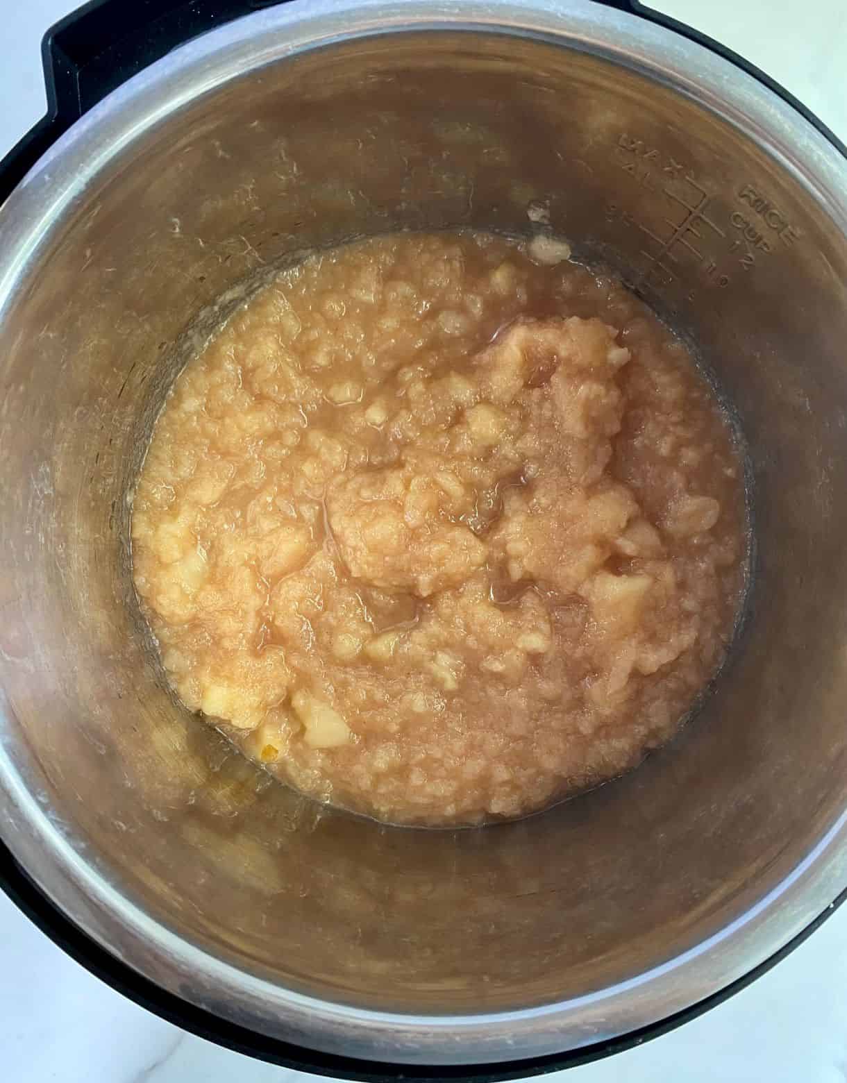 A slow cooker with homemade applesauce.